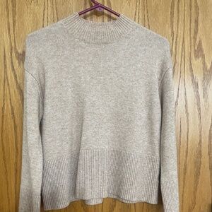 Cute beige sweater with bell sleeves